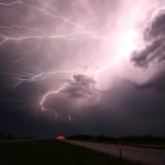 Bright lightning storm over a rural landscape in Javea, Spain, showcasing dramatic thunderstorm activity perfect for outdoor weather and nature enthusiasts.